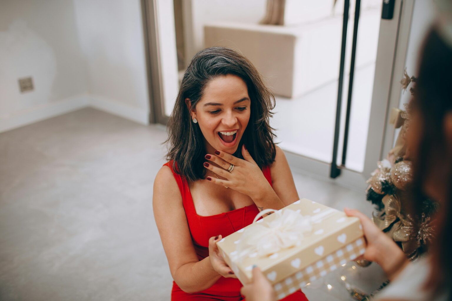 Lady in red accepting a surprise gift - blog page